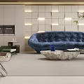 Modern Living Room With Blue Curved Sofa Lit Grid Wall And Marble Coffee Table