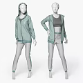 Two Models Wearing Light Green Zip Up Hoodies And Gray Track Pants With Stripes