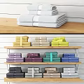 Neatly Folded Towels for Laundry Daily Use Displayed on Wooden Shelves with Multiple Colors