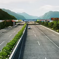 Highway Road Facilities Featuring Multiple Lanes Green Belts Trees Billboards And Scenic Mountain Views