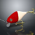 Red And White Fishing Lure With Golden Hooks And Transparent Lip On Dark Background