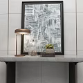 Elegant Console Table With Marble Top Metal Legs Table Lamp Glass Vase And Small Plant