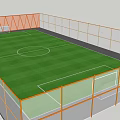 Soccer Field With Green Grass And White Boundary Lines Surrounded By Orange Fencing