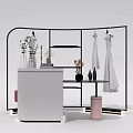 Black Metal Curved Clothes Hanger with Hanging Clothes Decorative Vases and White Counter