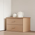 Light Wood Nightstand With Two Drawers Silver Handles And White Teapot Cup On Tray