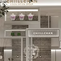 Elegant Clothing Store Window Display With Stylish Mannequin Hanging Lights And Decorative Plants