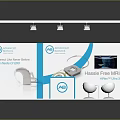 HearSonic Exhibition Booth Featuring White Frame Blue Floor Hearing Aids Display Lighting And Seating