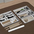 Organized Utensil Set With Wooden Metal Kitchen Tools In White Storage Trays On Brown Tabletop