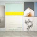 Abstract Portrait Paintings In Various Styles Hanging On Indoor Gallery Wall