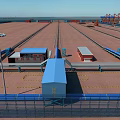 Spacious Industrial Plant Area With Red Cranes Blue Sky Water View And Rail Tracks