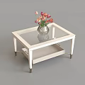 White Frame Glass Top Coffee Table With Lower Shelf And Tulip Vase