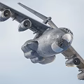 Military Fighter Jet With Four Engines Wide Wings And Landing Gear On Runway