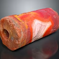 Natural Cylindrical Stone With Vibrant Red Orange Yellow White Patterns And Central Hole