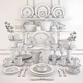 Elegant Blue And White Dinnerware Set With Gold Accents Displayed On Tiered Shelves