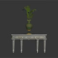 Light Colored Wooden Table With Drawers And Decorative Green Vase Holding Fern Plant