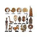 Various Carved Sculptures Display With Animal Human And Spiral Designs On Stands