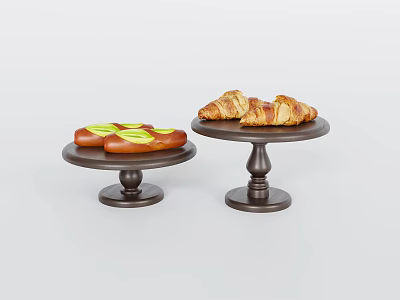 Appetizing Green Topped Long Bread and Croissants on Two Black Cake Stands 3d model