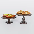 Appetizing Green Topped Long Bread and Croissants on Two Black Cake Stands