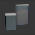 Metal Storage Tins With White Lids Holding Granular Contents On Dark Reflective Surface