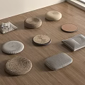 Various Woven And Fabric Floor Cushions Round And Rectangular On Wooden Floor