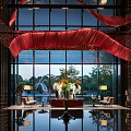 Elegant Hotel Lobby Front Desk Reception With Modern Design Large Windows And Flower Decorations