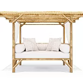 Stylish Outdoor Sofa with Bamboo Frame Woven Canopy White Curtains and Plush White Cushions