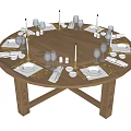 Elegantly Set Round Wooden Dining Table With Plates Cutlery Candles And Wine Glasses