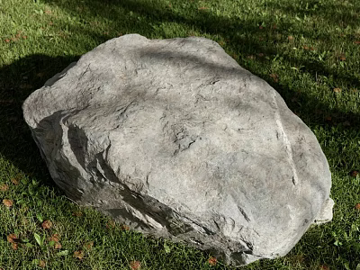 Large Natural Stone With Rough Surface Texture Lying On Green Grass Field 3d model