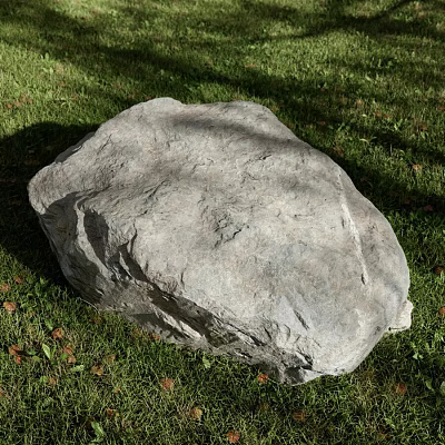 Large Natural Stone With Rough Surface Texture Lying On Green Grass Field 3d model