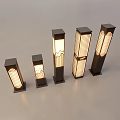Elegant Outdoor Pillar Lights with Woven Shades Various Sizes and Warm Glowing Light