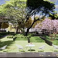 Residential Landscape Design With Green Lawn Flowering Trees And White Garden Furniture