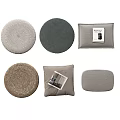 Assorted Cushions In Various Shapes With Woven And Fabric Textures In Neutral Tones