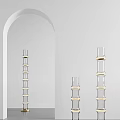 Three Transparent Glass Floor Lamps With Golden Ring Decorations And White Arched Mirror