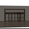 Brass Frame Revolving Door With Glass Panels Wooden Floor And Green Plant