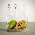 Fresh Ripe Whole and Sliced Papaya on Wooden Tray with Glass Water Bottles
