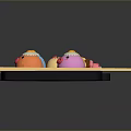 Colorful Animal Shaped Snacks Including Chicken and Octopus on Black Trays with Chopsticks