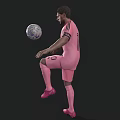 Man In Pink Soccer Jersey Juggling Soccer Ball On Dark Background