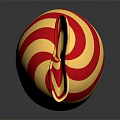 Red and White Striped Candy Wrapped in Gold Foil with Shiny Reflection on Black Surface