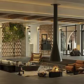 Cozy Modern Hotel Public Lounge Area With Stone Fireplace Sofa Armchairs And Green Plant
