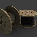 Vintage Wooden Cable Reels With Black Cables And Wooden Spools Placed Flat And Sideways