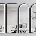Various Shaped Mirrors In Modern Living Room With Sofa And Plants
