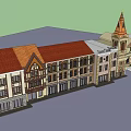 Hotel Building with Twin Orange Spires Classical Style Arched Entrance Adjacent Red Roof Buildings