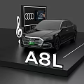 Sleek Black Audi A8L Sedan On Display Platform With Four Rings Logo And Screen