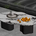 Modern Irregular Marble Top Coffee Table With Black Cylindrical Legs Green Plant And Oranges