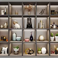 Decorative Ornament Set On Multi Tiered Display Shelf With Vases Figurines Plants And Geometric Decor