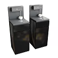 Two Modern Black Kitchen Water Dispensers With White Cups On Top