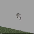Illuminated Outdoor Wall Lantern Casting Warm Light Beam Over Green Grass Area