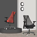 Two Red And Black Ergonomic Office Chairs With Mesh Design On Display Stand