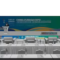 China Eurasia Expo Conference Venue With Podium Backdrop Tables Chairs And Water Bottles