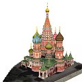 Historic Architectural Structure With Colorful Onion Domes Golden Spire And Red Walls